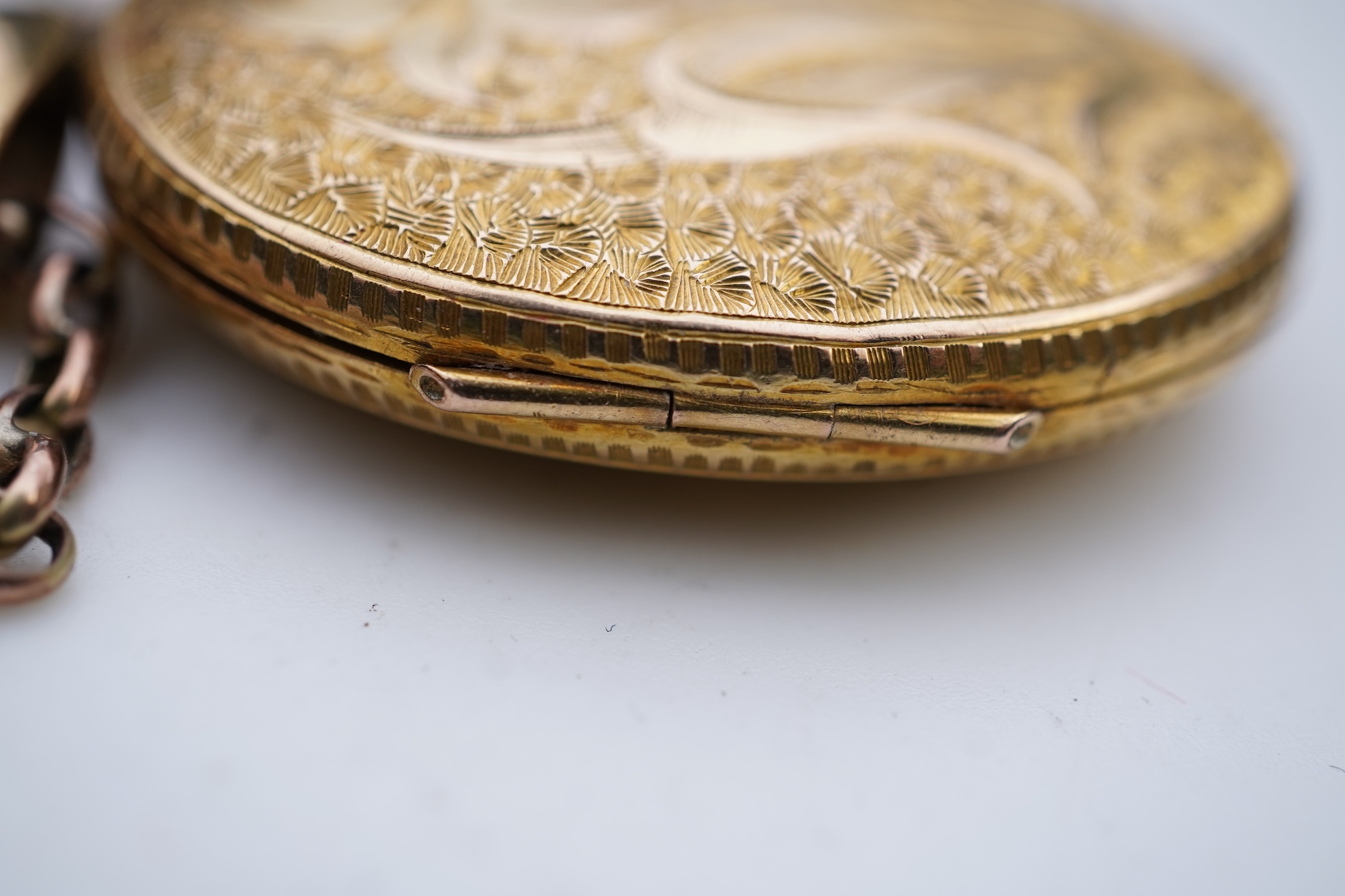 A gold locket and chain, late 19th century
